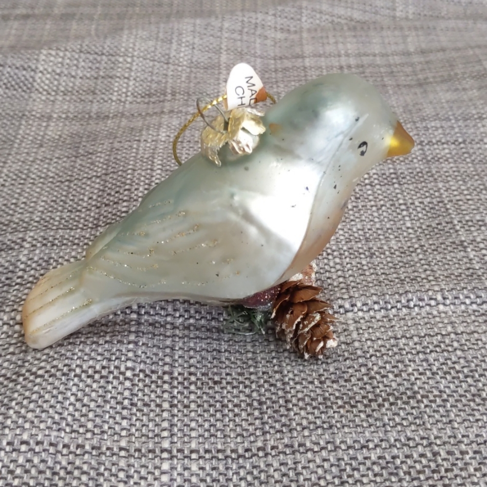 Bird on a pine stick ornament
